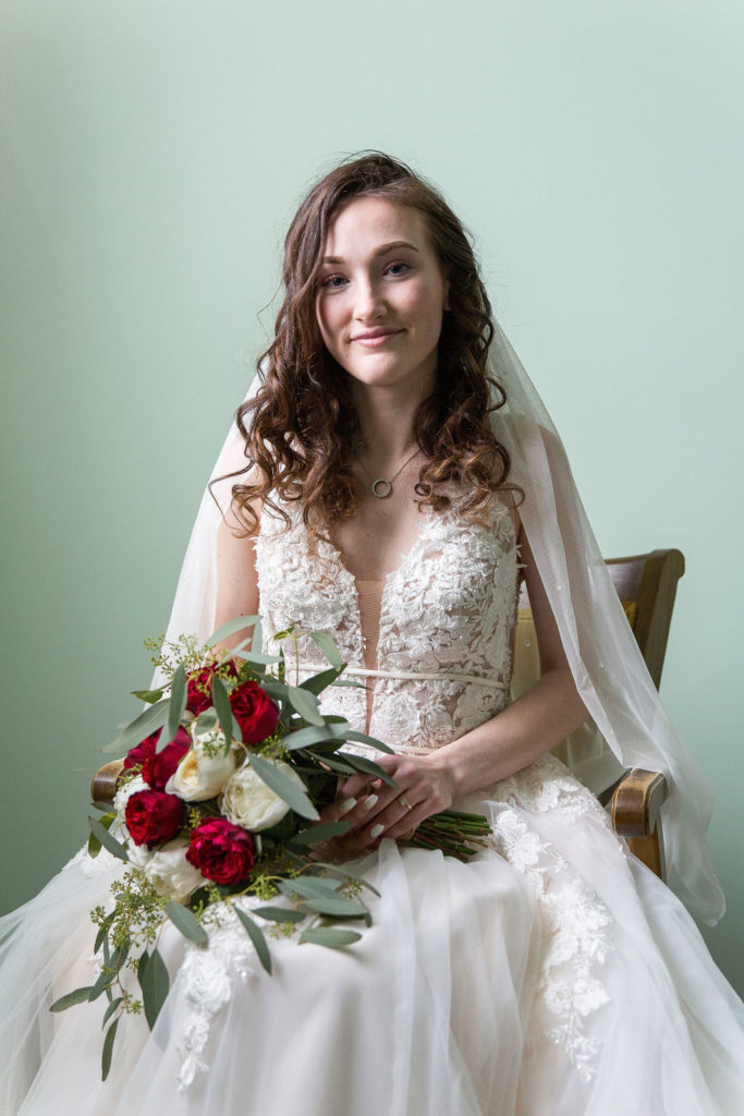 portrait of a bride in her wedding dress at Trinity Missionary Church in Yale, Michigan