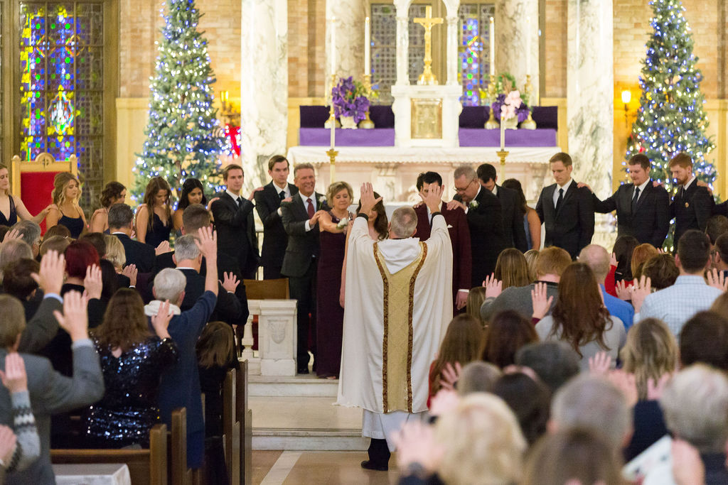 catholic winter wedding with christmas trees