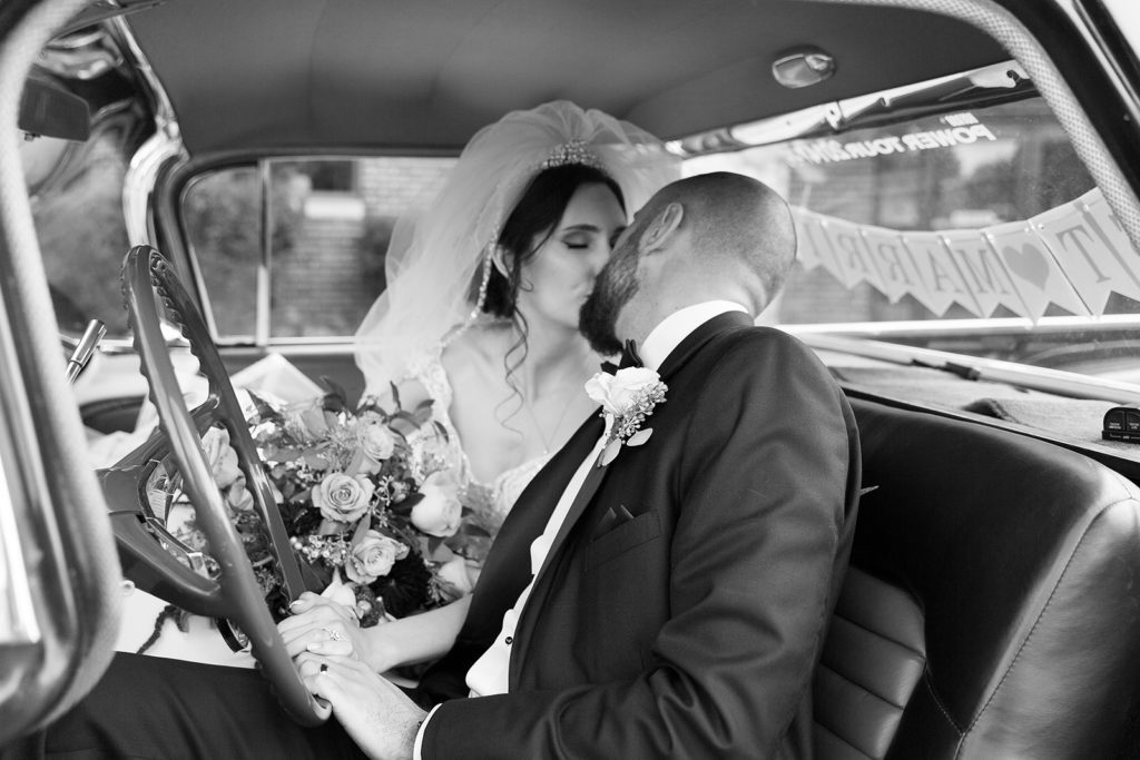 Vintage Car Rental at CityFlatsHotel and Trinity Lutheran Church in Port Huron wedding photographed by Taylor Ingles Photography