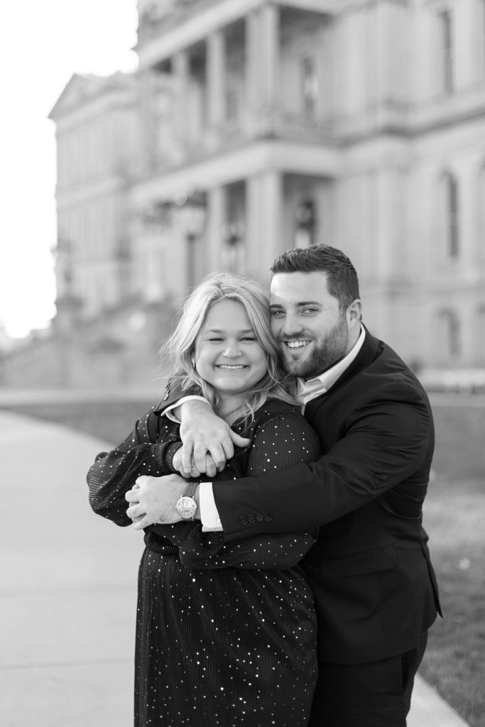 couple hugging near the Lansing Capitol Building