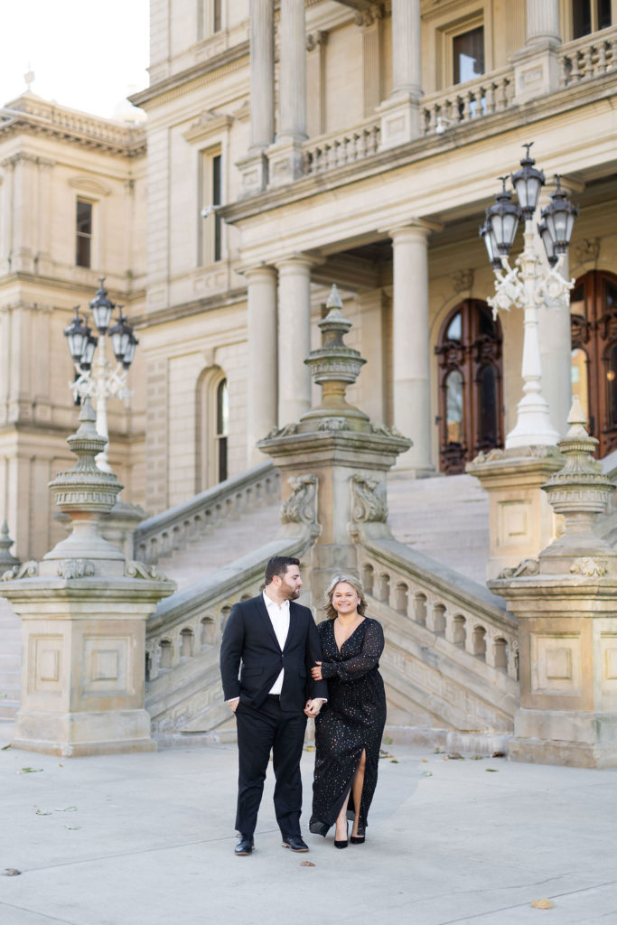 couple standing near the steps of the Lansing Capitol Building