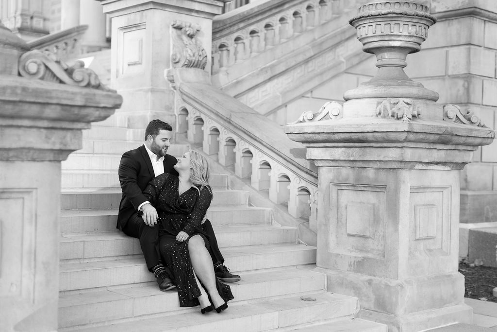 couple sitting on the steps of the Lansing Capitol Building